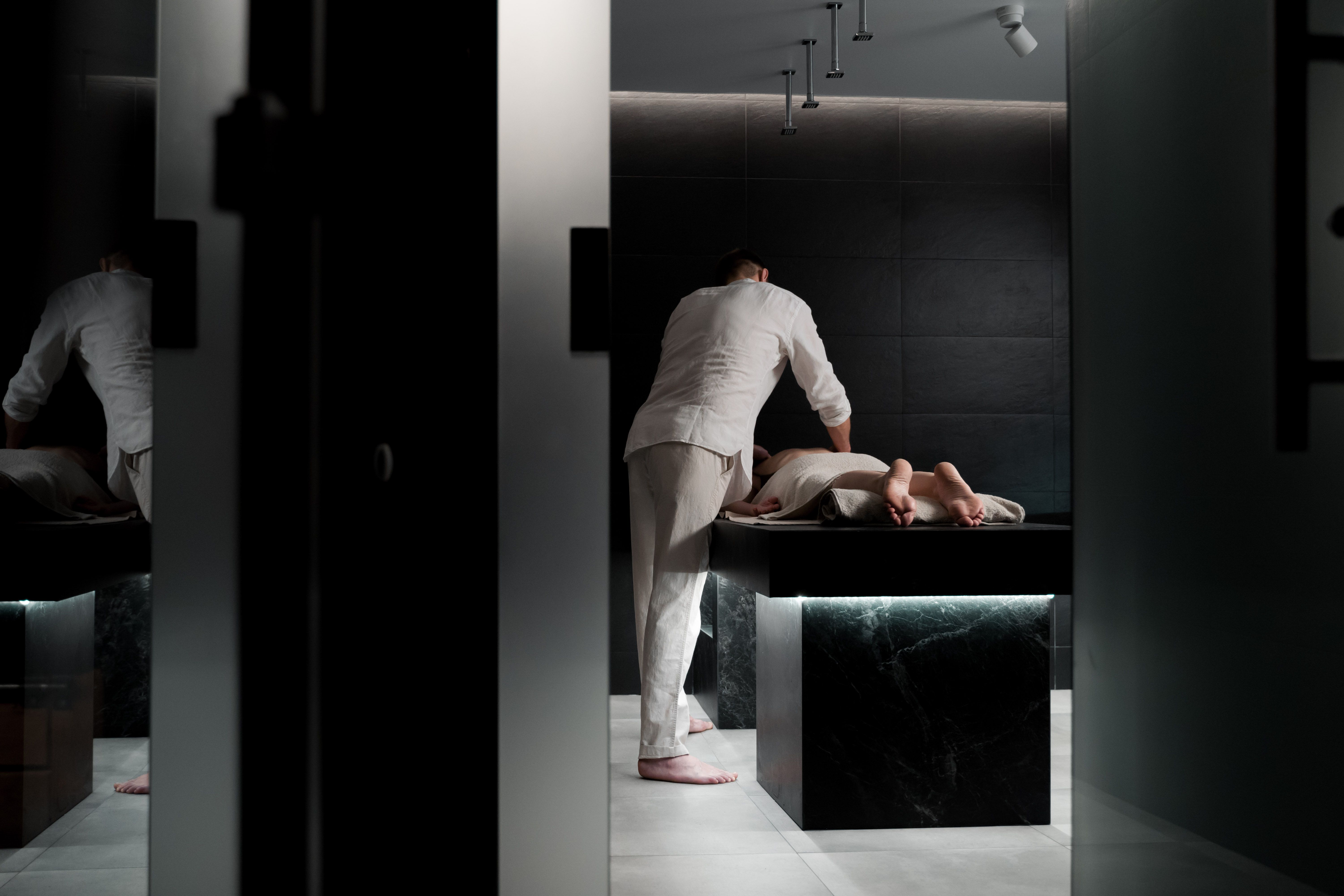 Professional relaxing massage in a modern luxury spa room