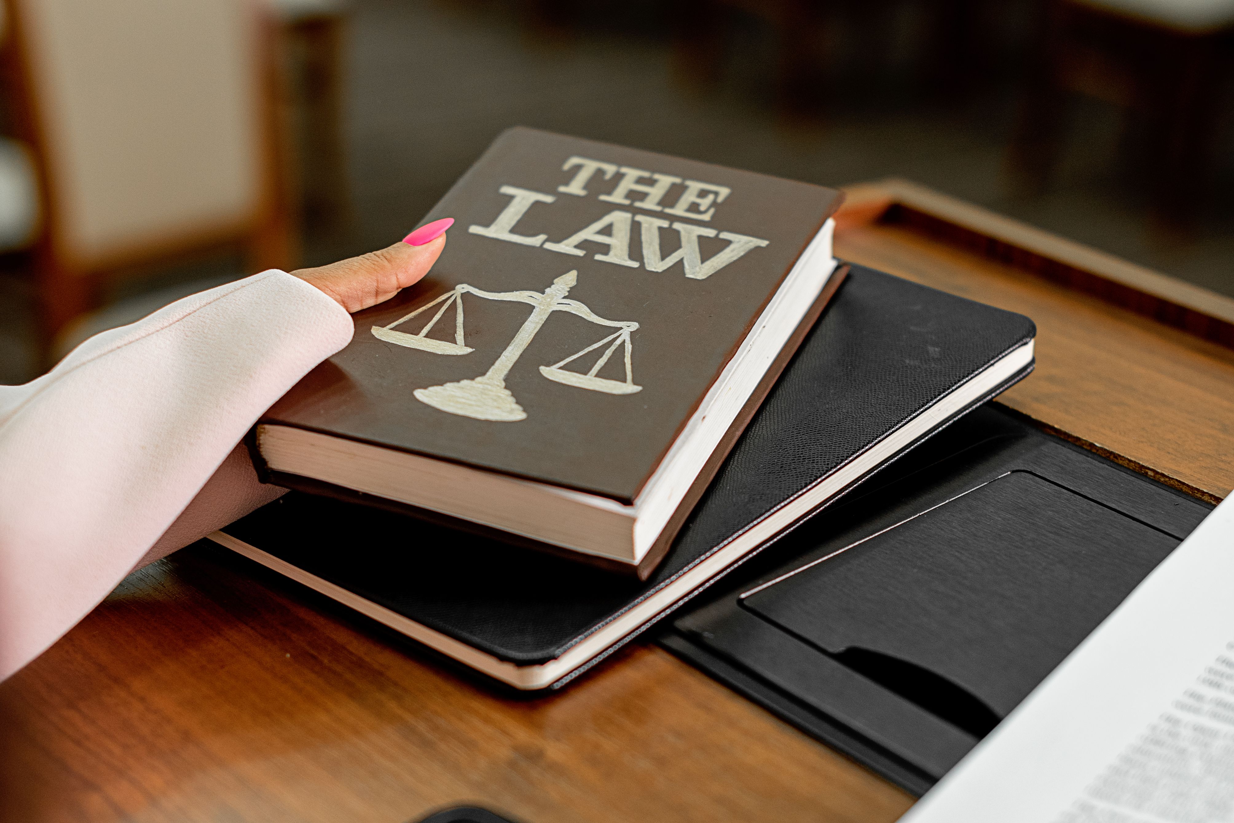 Law book and scales of justice representing disclosure rules and court procedure